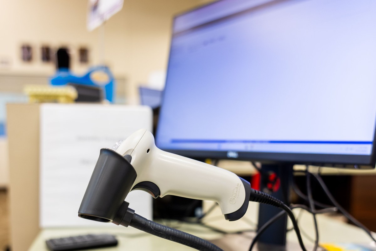 Pharmacist verifying pharmaceutical supply chain